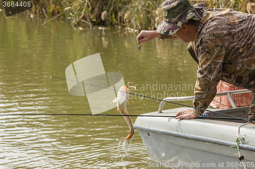 Image of Fisherman caught a catfish