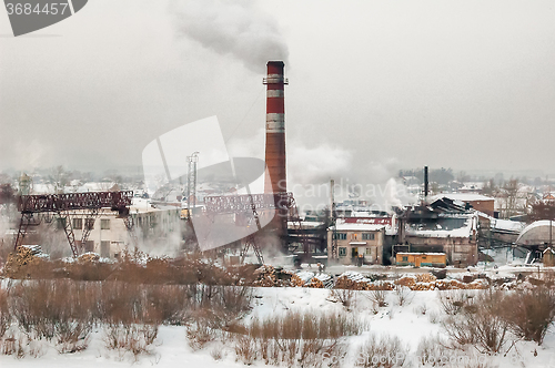 Image of Plywood combine on river bank. Tyumen. Russia