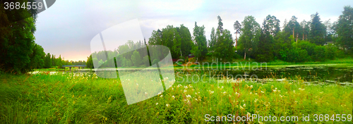 Image of river with green banks in suburbs