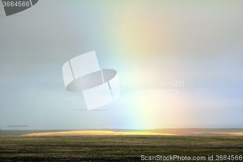 Image of Pale mist rainbow in polar desert. Novaya Zemlya Archipelago. Russian Arctic