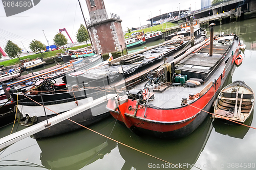 Image of view at old boats on Rotterdam canal 