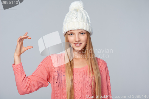 Image of Woman holding imaginary product