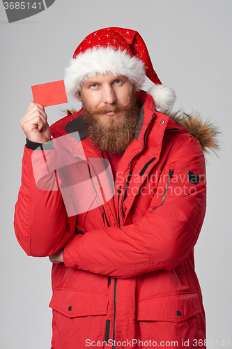 Image of bright picture of handsome man in christmas hat.