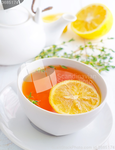 Image of Fresh tea with lemon in the white cup