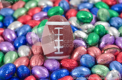 Image of gridiron, rugby, football egg amongst other easter eggs