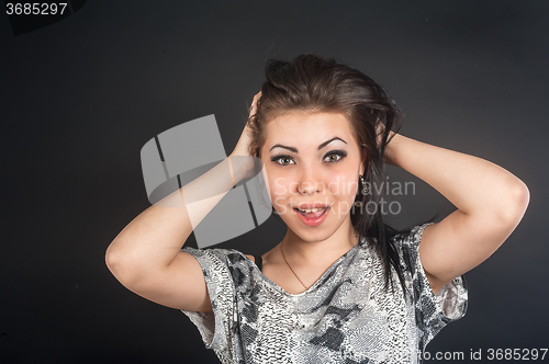 Image of Beautiful young surprised woman