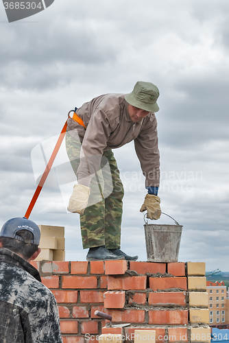 Image of Bricklayer on house construction
