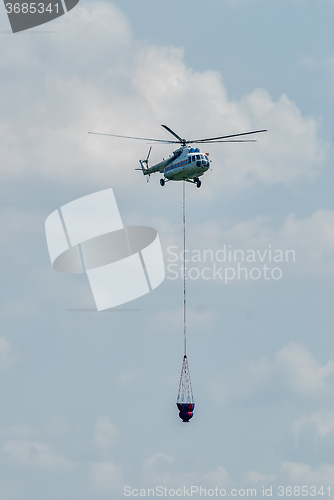 Image of MI-8 helicopter flies for fire extinguishing