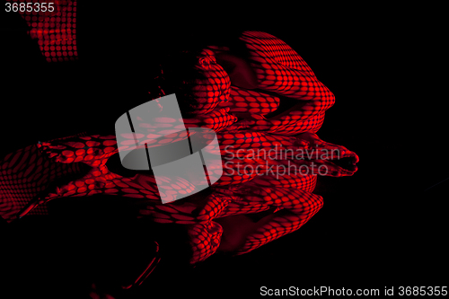 Image of The  body of woman with red pattern and its reflection