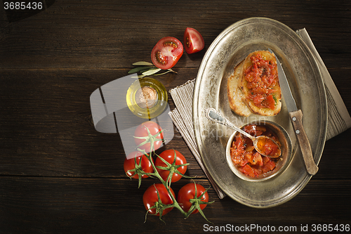 Image of Appetizer with tomato sauce and bruscetta.
