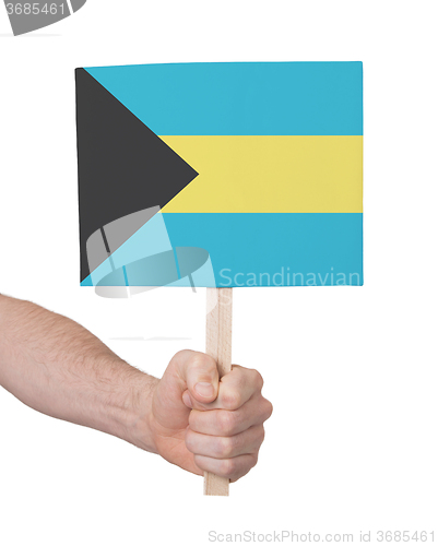 Image of Hand holding small card - Flag of Bahamas