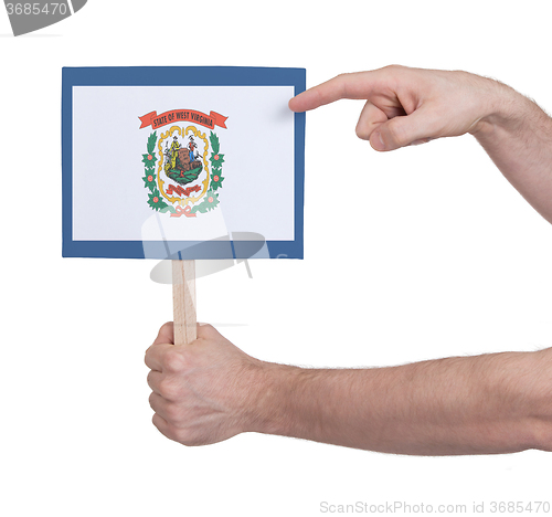 Image of Hand holding small card - Flag of West Virginia