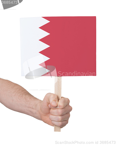 Image of Hand holding small card - Flag of Bahrain