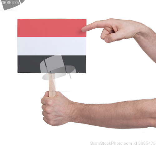 Image of Hand holding small card - Flag of Yemen