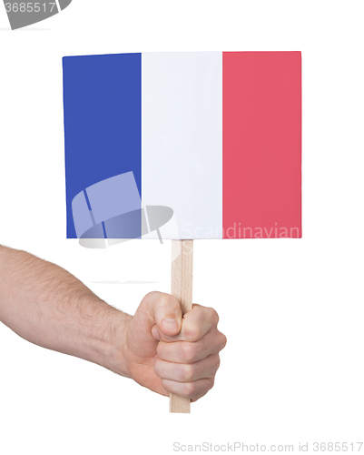 Image of Hand holding small card - Flag of France