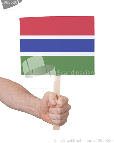 Image of Hand holding small card - Flag of Gambia