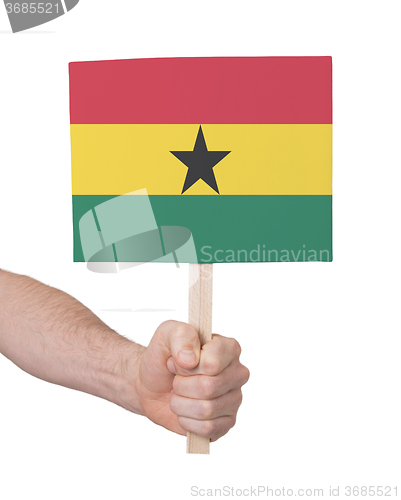 Image of Hand holding small card - Flag of Ghana