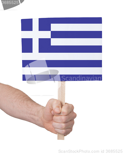 Image of Hand holding small card - Flag of Greece