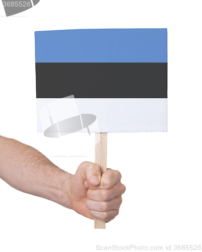 Image of Hand holding small card - Flag of Estonia