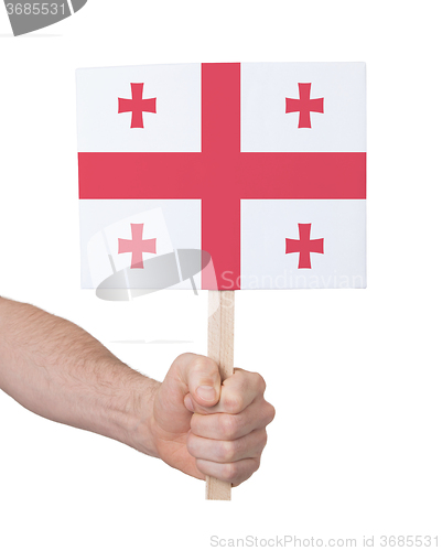 Image of Hand holding small card - Flag of Georgia