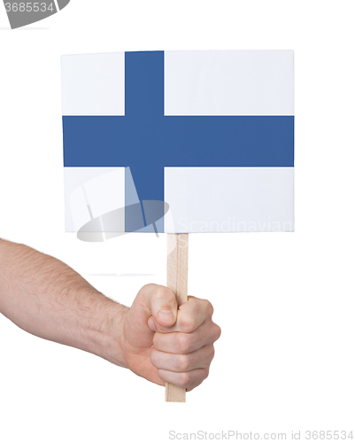 Image of Hand holding small card - Flag of Finland