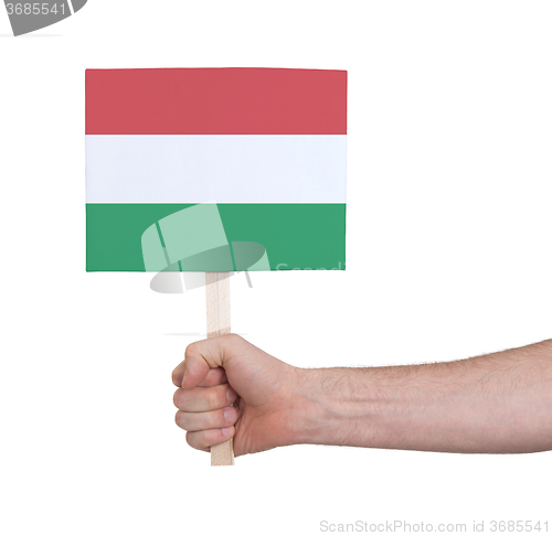 Image of Hand holding small card - Flag of Hungary