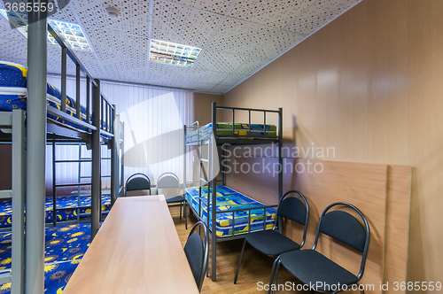 Image of bunk metal beds in hostel room