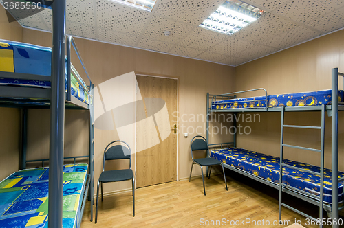 Image of bunk metal beds in hostel room