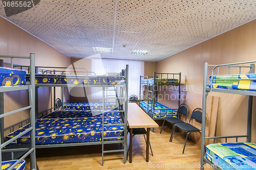 Image of bunk metal beds in hostel room