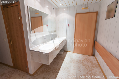 Image of bathroom with sinks in hostel
