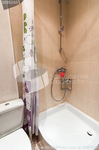 Image of bathroom with sink toilet and shower tray