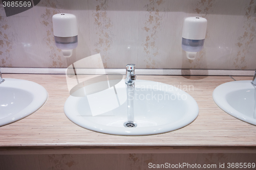 Image of bathroom with sinks in hostel