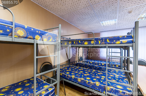 Image of bunk metal beds in hostel room