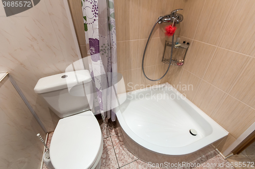 Image of bathroom with sink toilet and shower tray