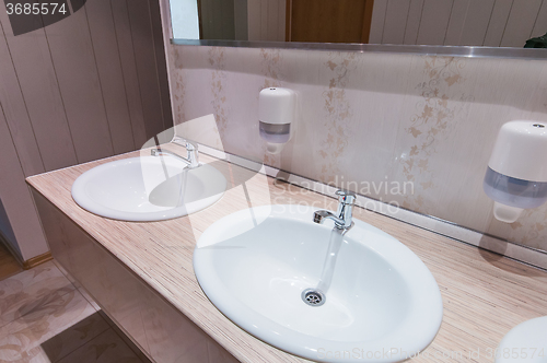 Image of bathroom with sinks in hostel