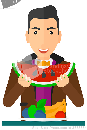 Image of Man eating watermelon.