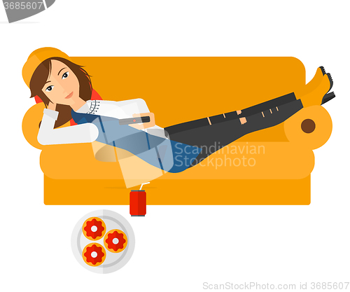 Image of Woman lying on sofa with junk food.