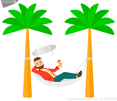 Image of Man chilling in hammock.