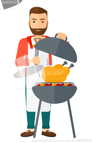 Image of Man preparing barbecue.