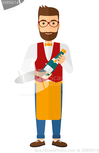 Image of Waiter holding bottle of wine.