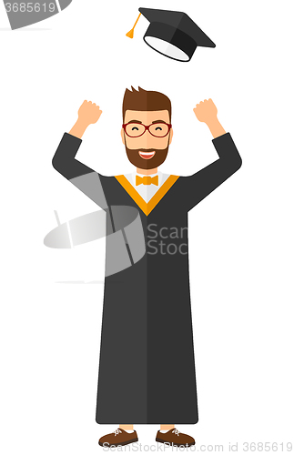 Image of Graduate throwing up his hat.