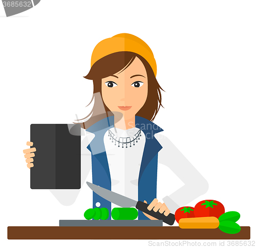 Image of Woman cooking meal.