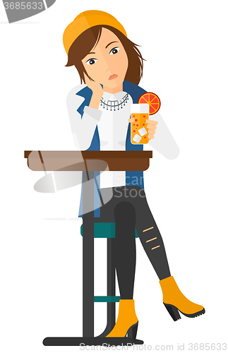Image of Woman sitting at bar.