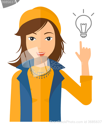 Image of Woman pointing at light bulb.