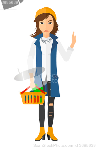 Image of Woman holding supermarket basket.
