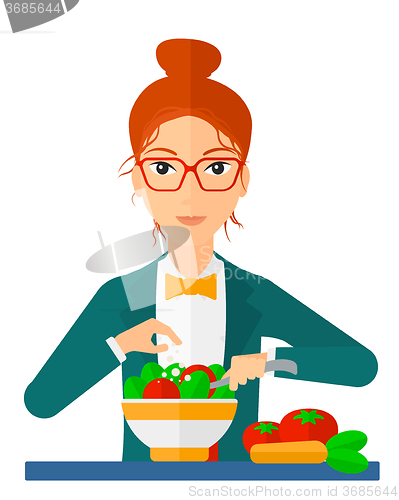 Image of Woman cooking meal.