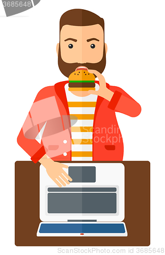 Image of Man eating hamburger. 