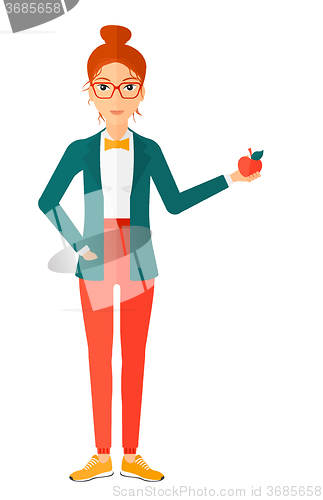 Image of Woman holding apple.