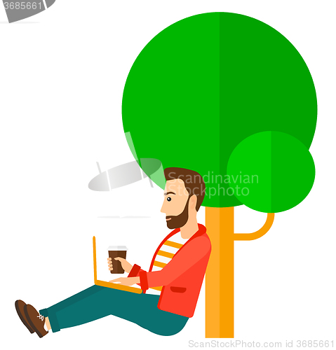 Image of Man using laptop for education.