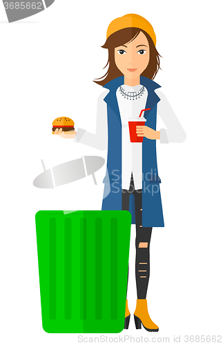 Image of Woman throwing junk food.